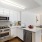 a kitchen with white cabinets