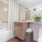 a bathroom with a tub toilet and sink