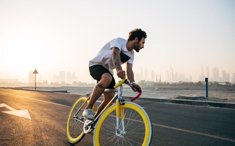 Find your perfect fit at The Melar a man riding a bicycle on a road
