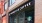 a store front with a sign