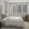 a bedroom with a bed and a lamp