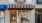 a store front with a bench