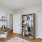 a room with a desk and a bookcase