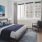 a bedroom with a large window